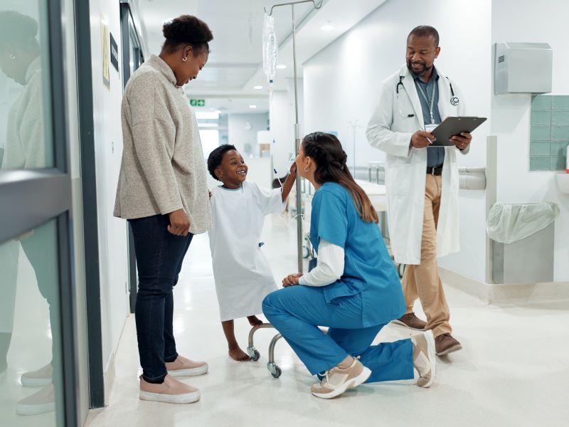 A group of people in the corridor of a hospital